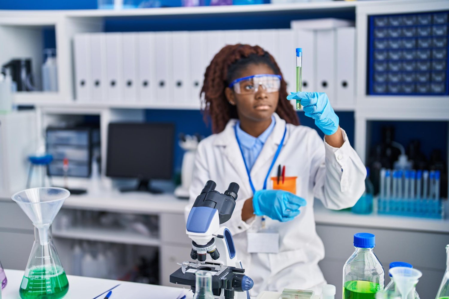 african-american-woman-scientist-holding-test-tube-laboratory